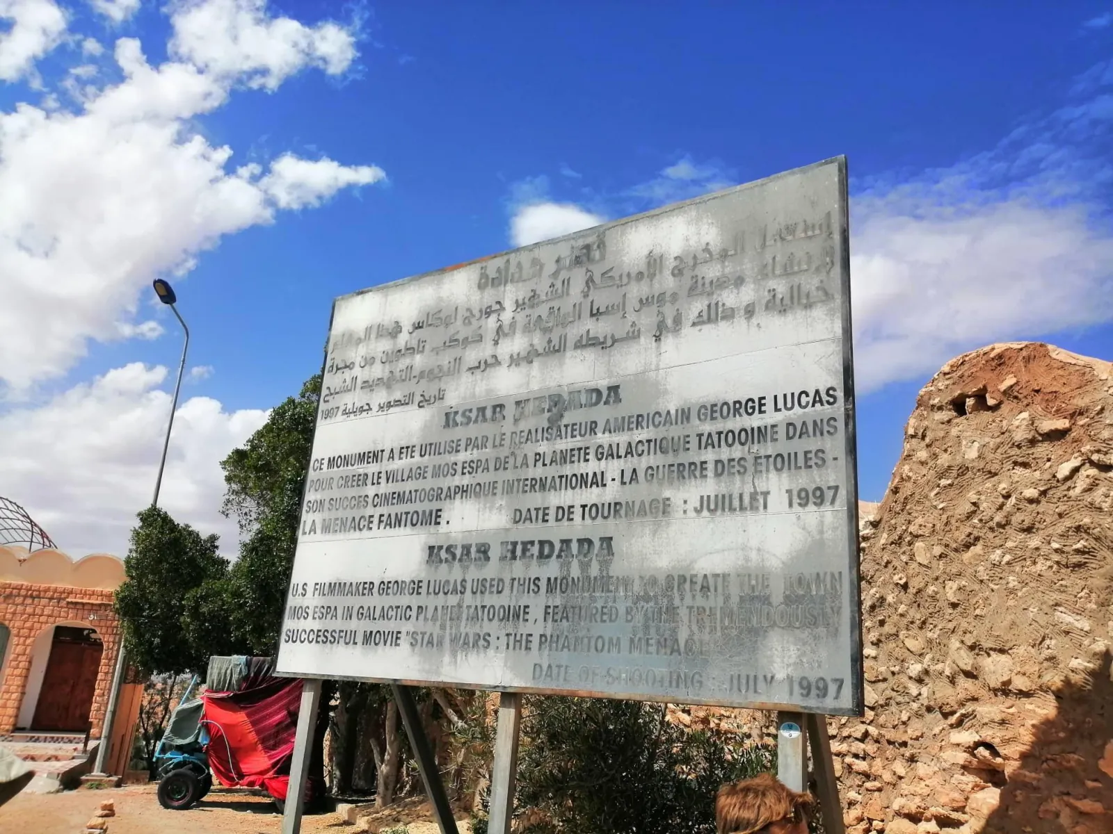 The interpretation sign at Ksar Hadada recording its use as Mos Espa in July 1997