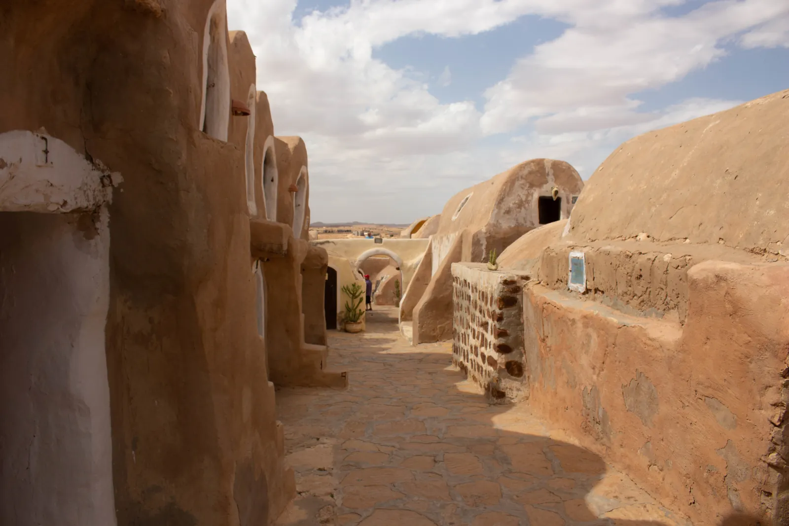 The domed lane inside Ksar Hadada, whitewashed arches on either side of a paved path