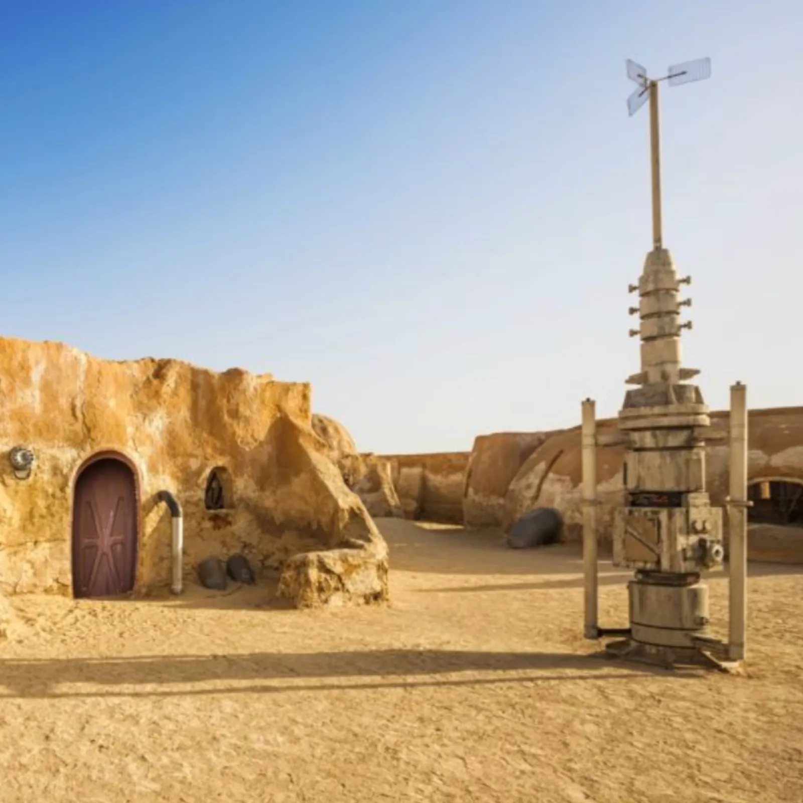The Mos Espa film set: domed mud buildings and a standing moisture vaporator in open desert