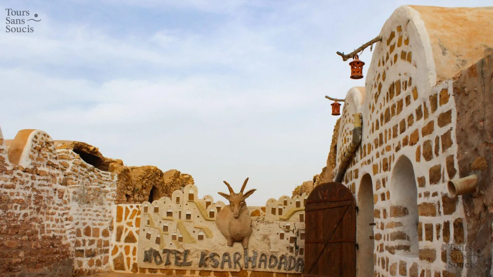 The courtyard entrance to Ksar Hadada, its ibex sculpture above a modelled ksar frieze