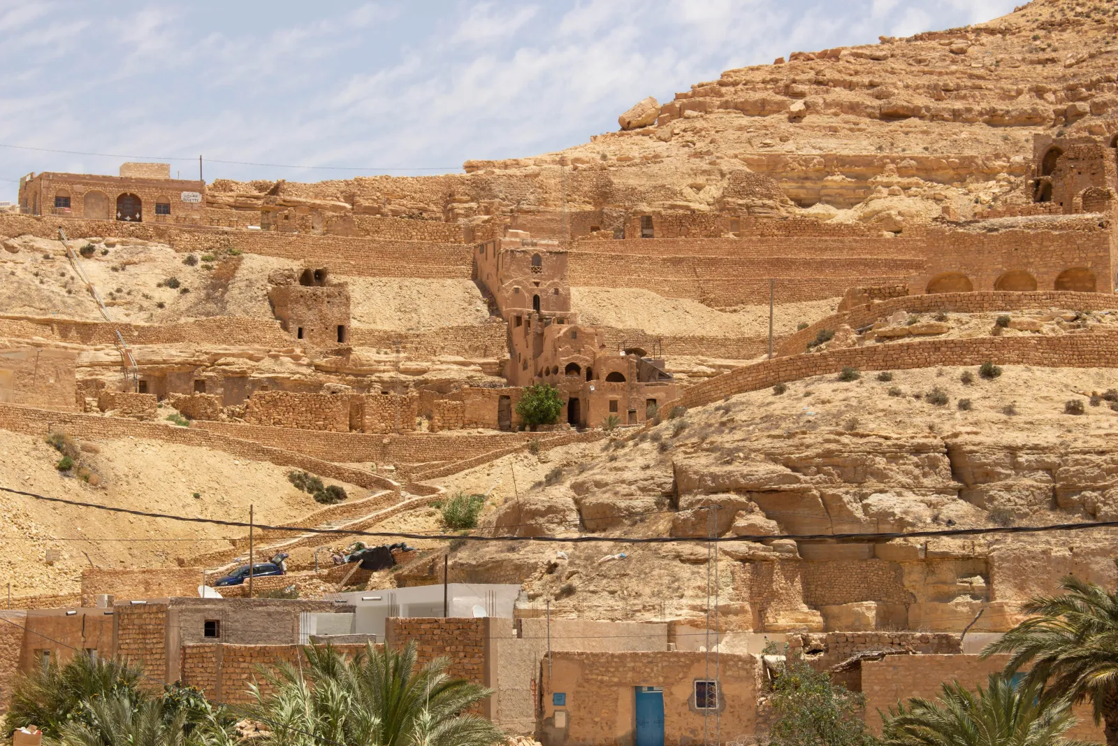 Terraced cliff dwellings and cave houses cut into the hillside at Chenini